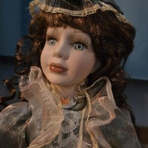 Vintage Porcelain Doll with Curly Hair